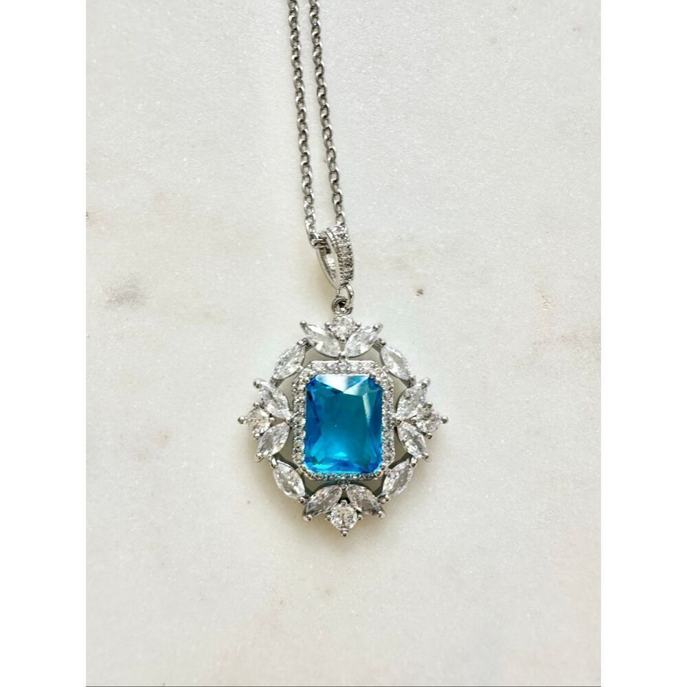 Bright blue sparkly elongated radiant cut cubic zirconia pendant necklace